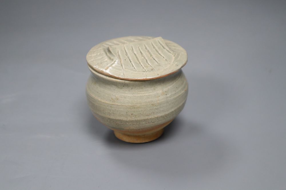 A Chinese Song/Yuan Dynasty Qingbai small jar with tiled roof cover, height 8.5cm